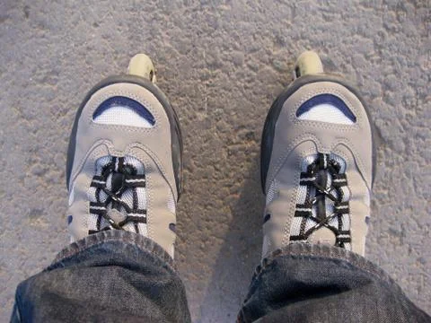 Roller skates on asphalt Stock Photos