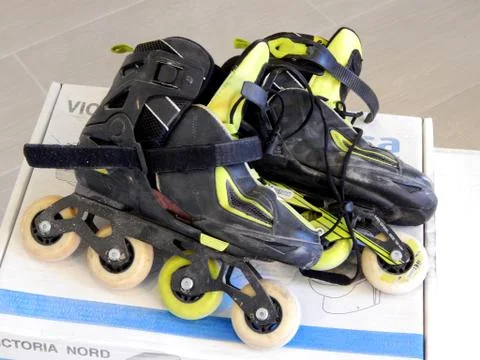Roller skates on the box Stock Photos