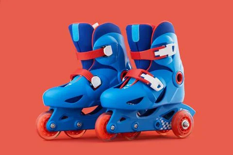 Roller skates isolated on red background Stock Photos