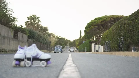 Roller skates on road Stock Footage 86564971