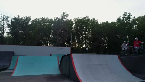 Roller skating guy performs a skatepark trick Video stock 102260288