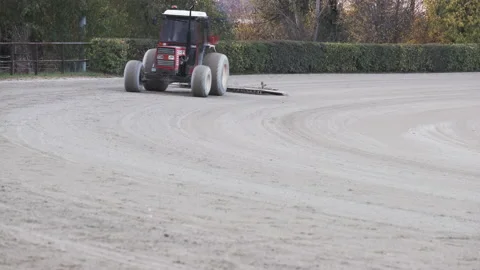 Roller Tractor prepares the arena field for an Equestrian competition in Italy 動画素材 164980160