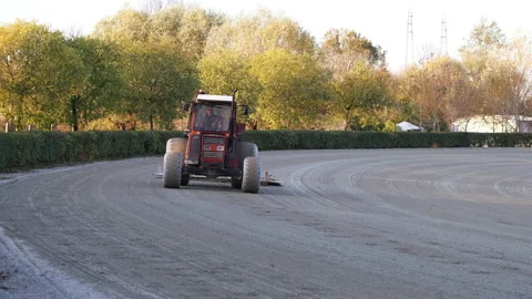 Roller Tractor prepares the arena field for an Equestrian competition in Italy 動画素材 164986238