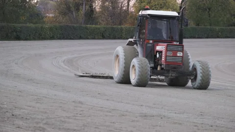 Roller Tractor prepares the arena field for an Equestrian competition in Italy 動画素材 164995808