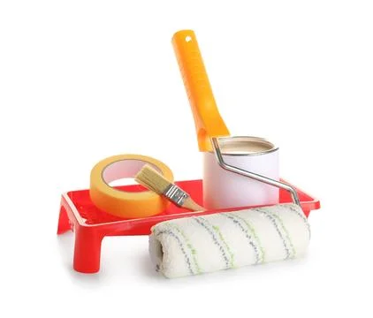 Roller with tray, brush, can of paint and adhesive tape roll on white backgro Stock-Fotos