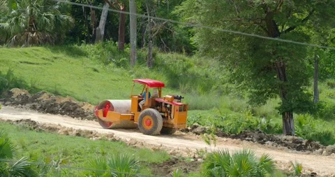 Roller work making new road. Ground is leveled before asphalt can be laid. Stock Footage 219340640