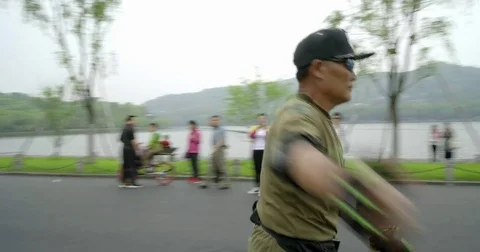Rollerblade Performer enjoyed by Locals at West Lake, Hangzhou China in 4K. Video stock 80388468