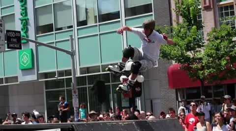 Rollerblader does a 360 jump Stock Footage 8960058