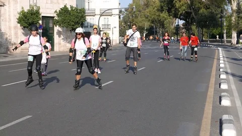 Rollerbladers compete in a 5k Run and Rollerblading Against Cancer Stock Footage 81677643