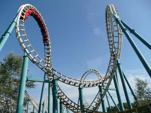 Rollercoaster in amusement park Stock Photos