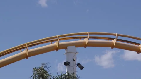 A rollercoaster flies over a bump in the track at Pacific Park amusement Stock Footage 137775799
