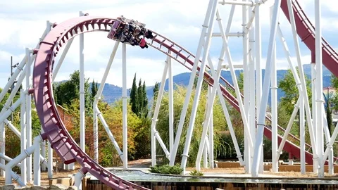 Rollercoaster at full speed at Rainbow Magicland fun Video stock 79772575