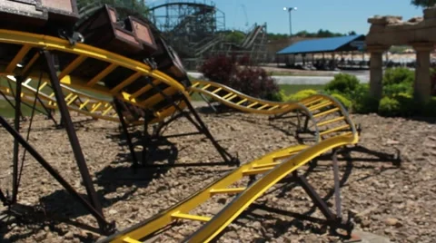 Rollercoaster gliding on tracks Stock Footage 64531743