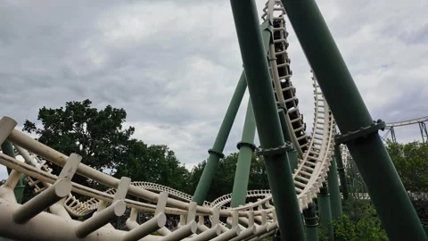 Rollercoaster going through a vertical loop and rushing by in the Efteling Video stock 337745443