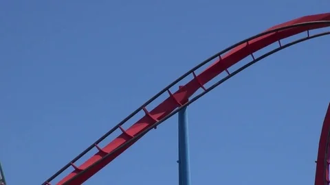 Rollercoaster ride on an amusement park Video stock 69734168