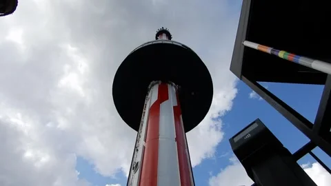 Rollercoaster Tower Ride Goes up Into the Sky on a Cloudy Day Stock Footage 332381516
