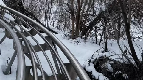 Rollercoaster track covered in snow during winter Video stock 297675113