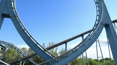 Rollercoaster train is moving along the loop Stock Footage 50524218