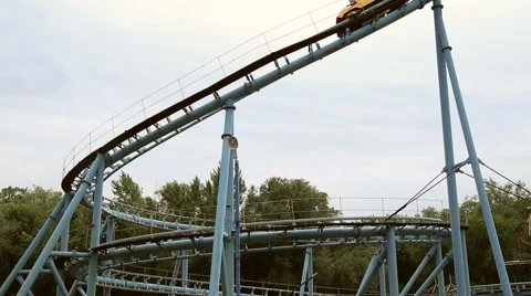 Rollercoaster train is moving along the loop Stock Footage 64596465