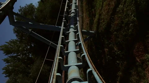 Rollercoaster train is moving along the loop Stock Footage 64744865