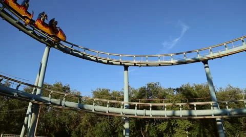 Rollercoaster train is moving along the loop Stock Footage 64745765