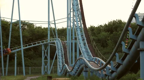 Rollercoaster train is moving along the track Stock Footage 64744301