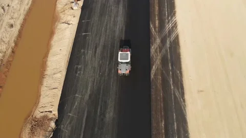 Rollers compact  is driving over freshly poured asphalt, Stock-Footage 146841127