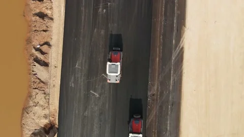 Rollers compact  is driving over freshly poured asphalt, Stock-Footage 146841782