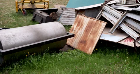 Rollers for laying asphalt. Metal sections and other metal debris. Stock Footage 242805466