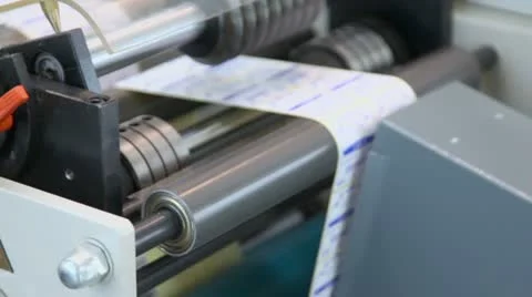 Rollers spins in sticker machine which makes labels , closeup Stock Footage 21241800