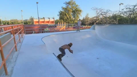 Rollerskater Jumping a Ramp Transfer to a Bowl at Skatepark Stock Footage 238008480