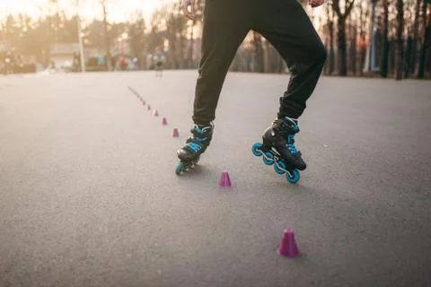 Rollerskater, rollerskating trick exercise in park Stock Photos