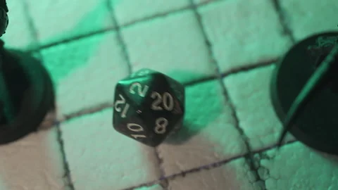 Rolling 20-sided or d20 dice to play tabletop game Stock Footage 271510066