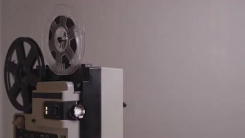 Rolling 8mm projector, vintage or retro machine for film strip Stock Footage 147892995