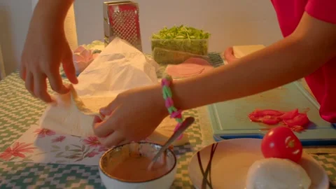 Rolling and folding rice mixture into vibrant edible wraps inside Stock Footage 325164244