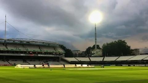 Rolling back the covers from the pitch at Lords Cricket Ground London, Stock Footage 274172581
