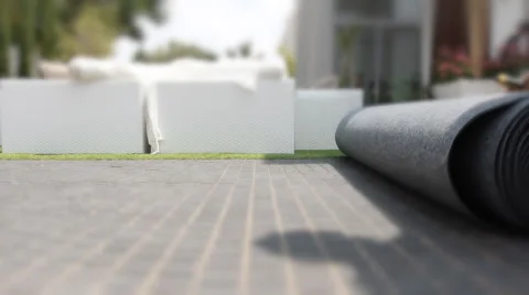 Rolling a big carpet  Stock Footage 44519331