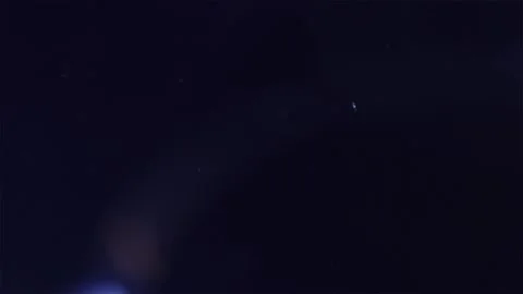 Rolling blue flashes on a dark background Stock Footage 252208107
