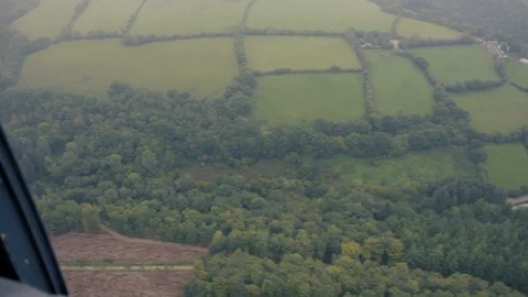Rolling British fields and countryside from a helicopter v2 Stock Footage 118266538