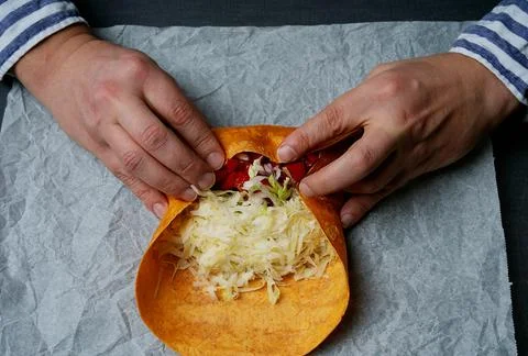 Rolling a burrito on a paper Stock Photos