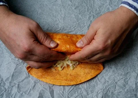 Rolling a burrito on a paper Foto stock