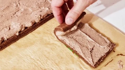 Rolling chocolate sponge cake with festive christmas tree pattern and cream fill Stock Footage 327259264