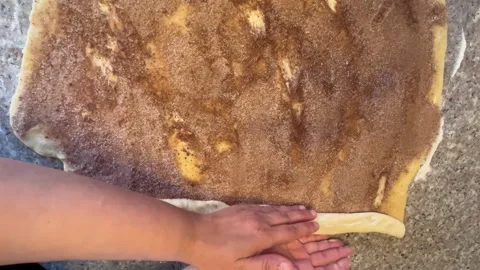 Rolling Up Cinnamon Sugar Dough for Pastry Making Stock Footage 345522445