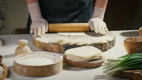 Rolling circles from dough Stock Footage 138126577