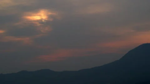 Rolling clouds on a misty sunrise, silhouette of mountains of China Video stock 249111160