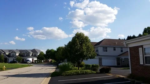Rolling clouds in neighborhood Stock Footage 94493619