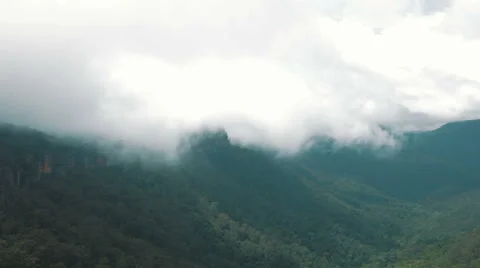 Rolling clouds over green hills Stock Footage 67408278