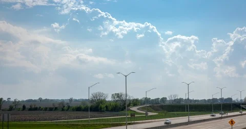 Rolling Clouds over Highway Stock Footage 91883711