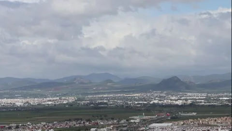 Rolling clouds over the landscape of Hidalgo Stock Footage 314331440