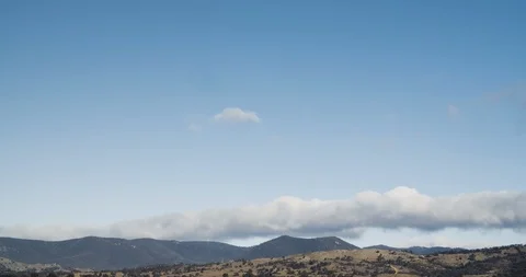 Rolling Clouds Over Mountains Blue Sky Timelapse 4K Stock Footage 113927984